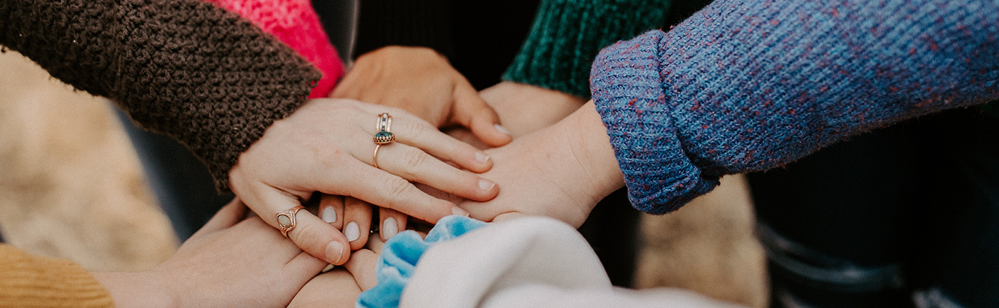 Image of several hands of different people