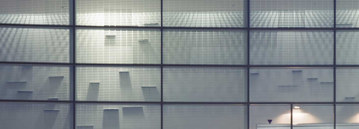 large windowpanes and droping lights in an atrium