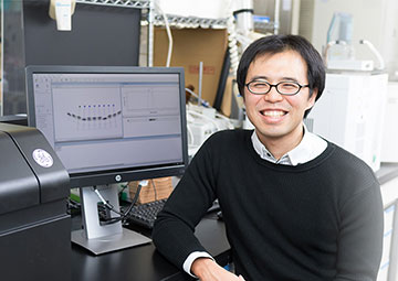 A team leader sitting in front of a computer display